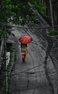 Rear view of man walking on street