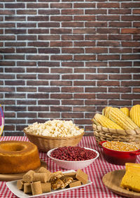 Food on table against brick wall