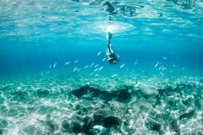 Woman swimming in sea