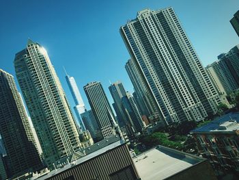 Low angle view of modern buildings against sky