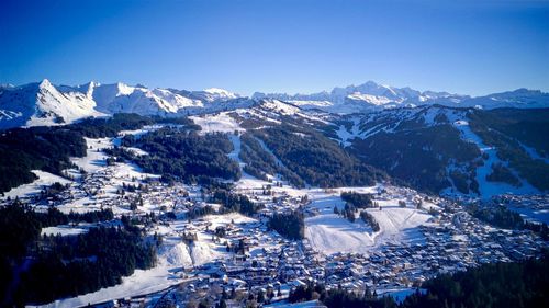 Scenic view of mountains against clear blue sky