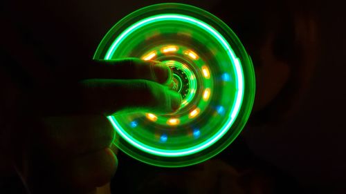 Close-up of light bulb against black background