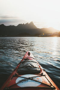 Boat in lake against mountains against sky