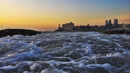 Scenic view of sea at sunset