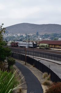 Scenic view of mountains against sky in city