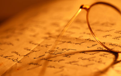 Close-up of eyeglasses on paper