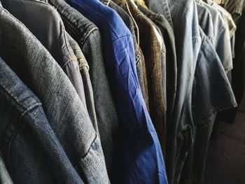 Close-up of clothes hanging in store