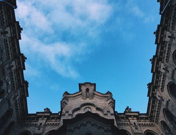 Low angle view of bell tower against sky