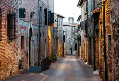 Narrow alley amidst buildings in city