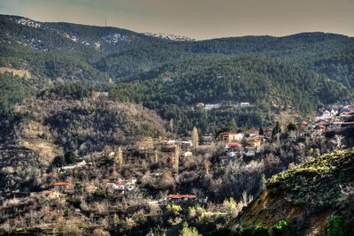 High angle view of houses and mountains against sky