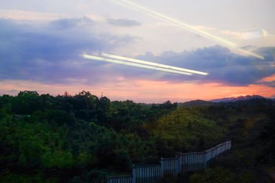 Scenic view of mountains against cloudy sky