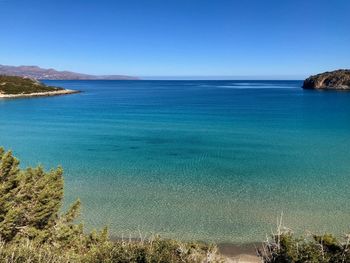 Scenic view of sea against clear blue sky