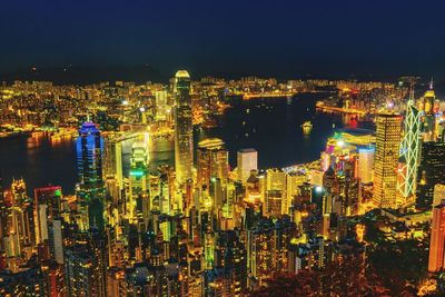 High angle view of illuminated modern buildings in city at night