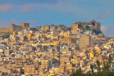 Aerial view of townscape against sky