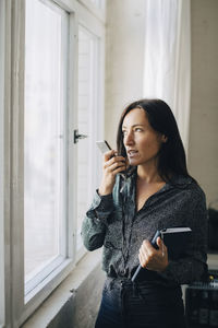 Young woman using mobile phone