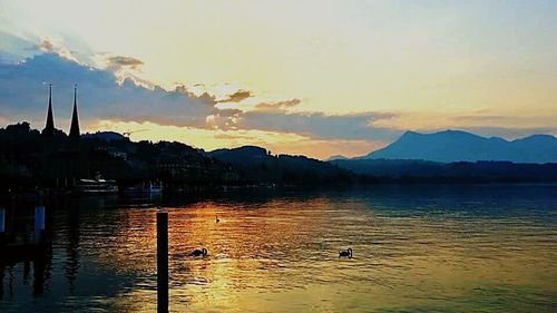 Scenic view of lake at sunset