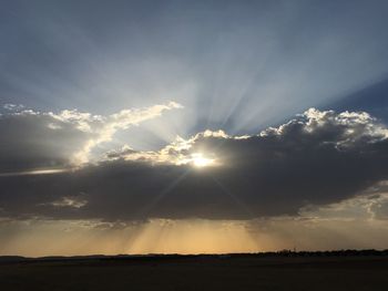 Scenic view of landscape against sky during sunset