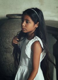 Close-up of young woman standing in mirror