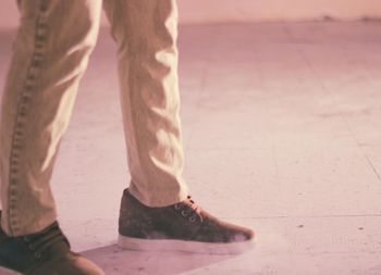 Low section of man standing on floor