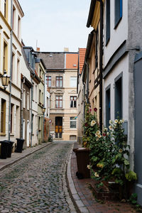 Alley amidst buildings in city