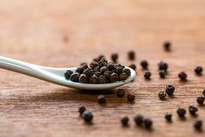 Close-up of coffee beans on table