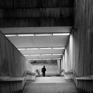 High angle view of man on illuminated staircase