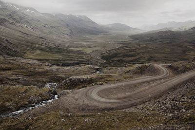 Country road leading towards mountains