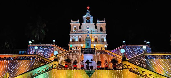 Illuminated buildings in city at night