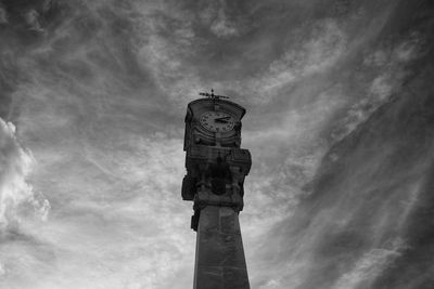 Low angle view of statue against sky