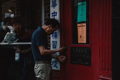 Young man standing at store