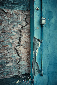 Closed door of weathered wall