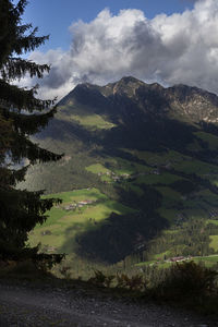 Scenic view of landscape and mountains against sky