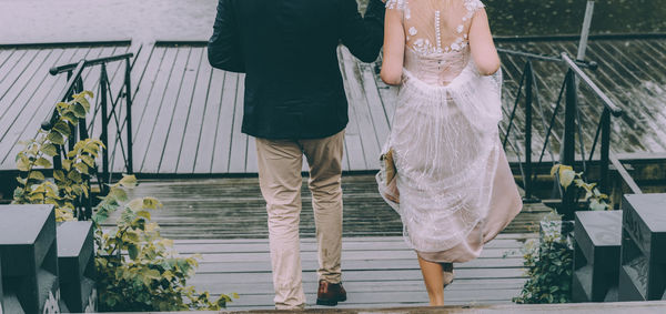 Low section of women walking on staircase