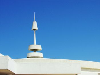 Communications tower against blue sky
