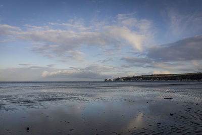 Scenic view of sea against sky at sunset