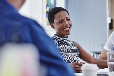 Smiling woman in a meeting