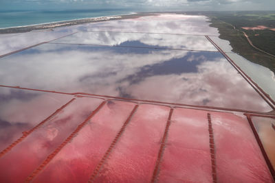 High angle view of swimming pool by sea against sky