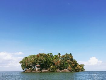 Island against blue sky