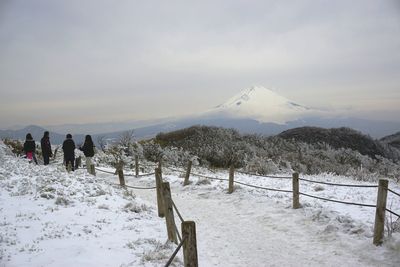 Scenic view of mountains against cloudy sky