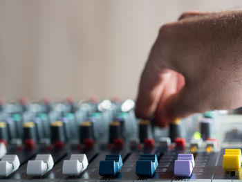 Close-up of man playing sound mixer