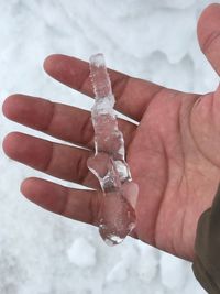 Close-up of hand holding ice cream