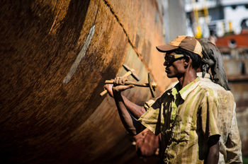 CLOSE-UP PORTRAIT OF MAN STANDING IN TRADITIONAL CLOTHING