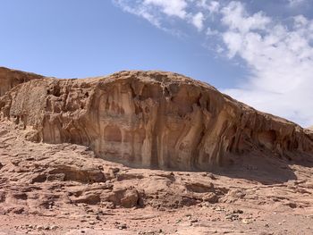 Rock formations on landscape against sky