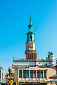 Low angle view of building against blue sky