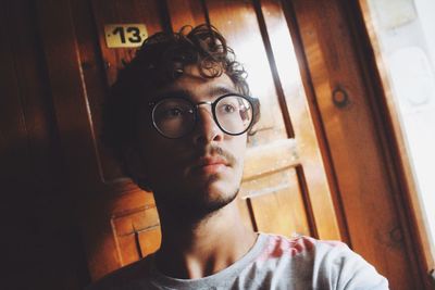 Close-up portrait of young man at home