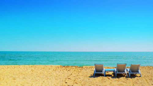 Bed beach and table beside the sea landscape background on summer season.