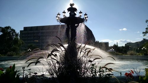 Statue fountain against sky