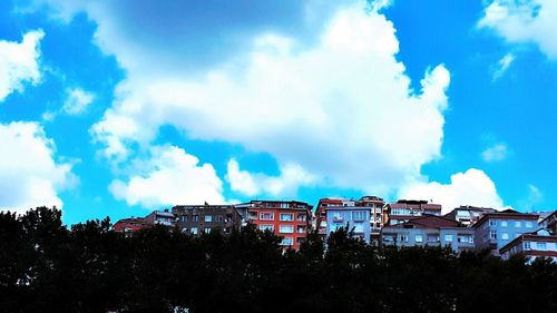 Low angle view of building against cloudy sky