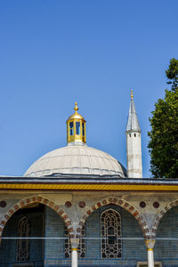 Low angle view of building against blue sky