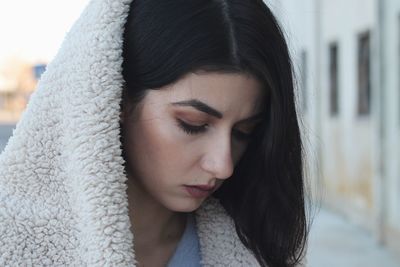 Close-up portrait of a woman looking away